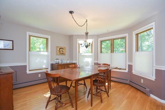 26 Kittredge St, Walpole, MA 02081 - dining room with baseboard heating, light wood-style flooring, and a chandelier