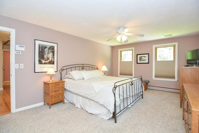 26 Kittredge St, Walpole, MA 02081 - bedroom featuring a baseboard radiator, light carpet, a ceiling fan, and baseboards