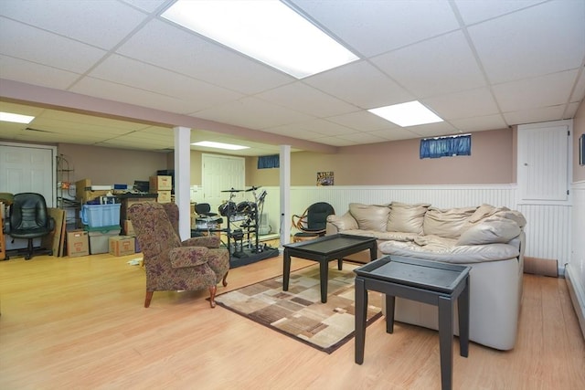 26 Kittredge St, Walpole, MA 02081 - living area featuring a drop ceiling, light wood finished floors, wainscoting, and an office area