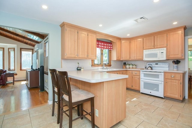 26 Kittredge St, Walpole, MA 02081 - kitchen with white appliances, a peninsula, light countertops, plenty of natural light, and recessed lighting