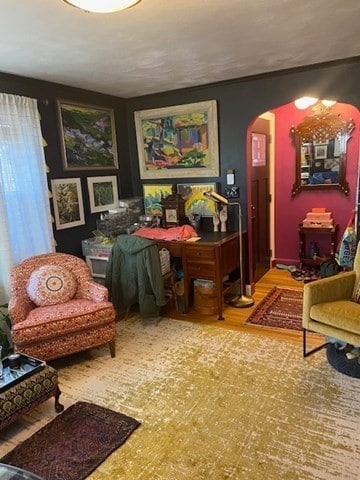 sitting room with hardwood / wood-style flooring