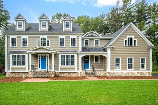 view of front of property featuring a porch and a front yard