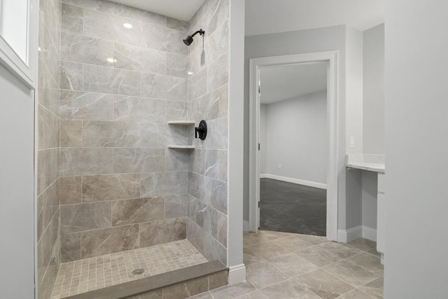 bathroom featuring vanity and a tile shower