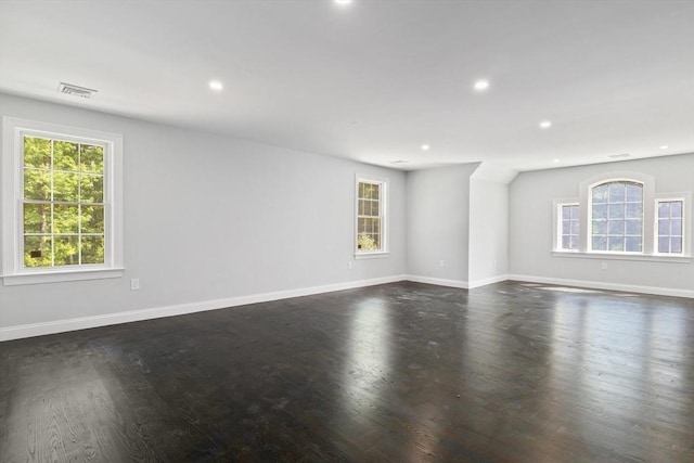 unfurnished room featuring dark wood-type flooring