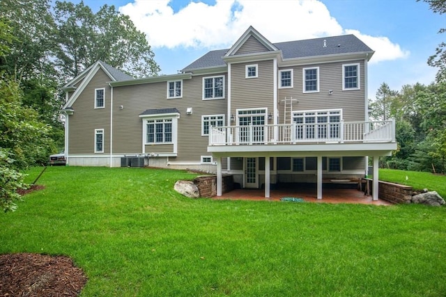 back of house featuring central AC, a yard, and a deck