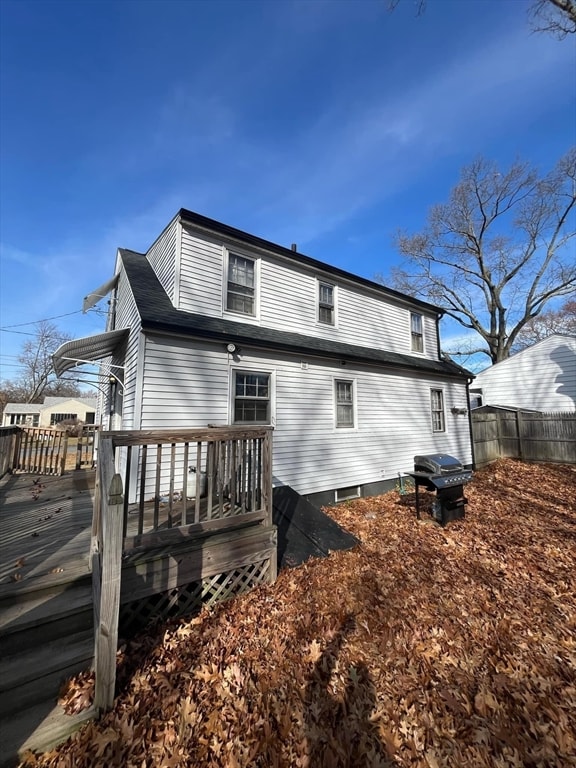 rear view of property with a deck