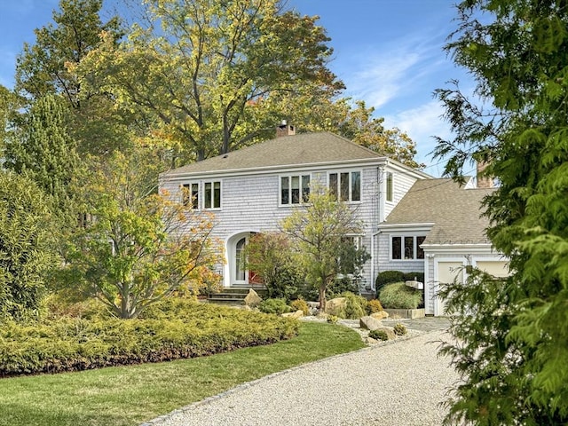 21 Fremont St, Dartmouth, MA 02748 - colonial inspired home featuring a chimney, driveway, roof with shingles, and an attached garage