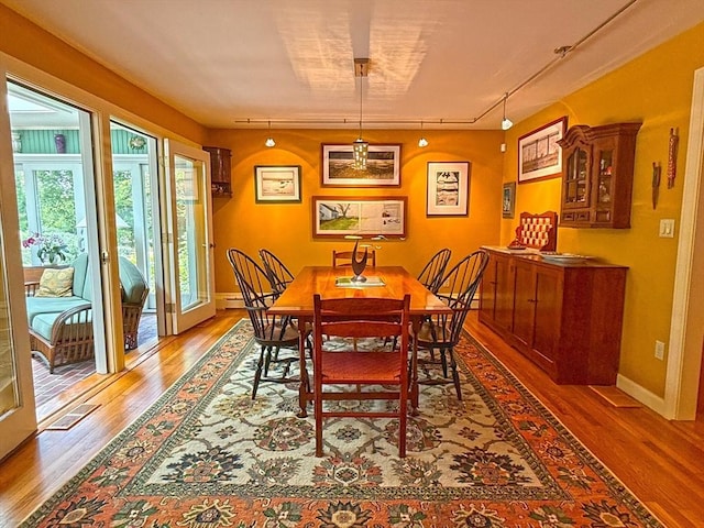 21 Fremont St, Dartmouth, MA 02748 - dining space with wood finished floors, track lighting, and baseboards