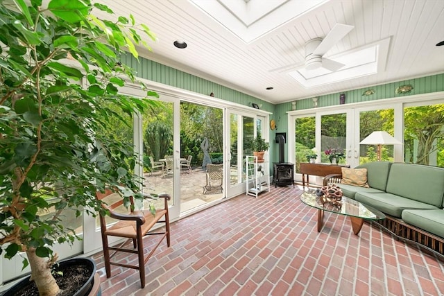 21 Fremont St, Dartmouth, MA 02748 - sunroom / solarium with a skylight, french doors, and a wood stove