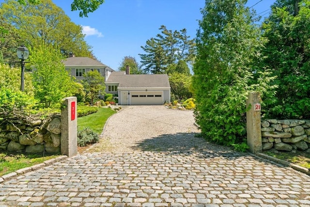 21 Fremont St, Dartmouth, MA 02748 - view of front facade with decorative driveway and an attached garage