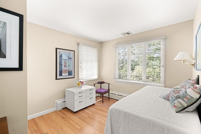 21 Fremont St, Dartmouth, MA 02748 - bedroom featuring light wood-type flooring, baseboards, and a baseboard radiator