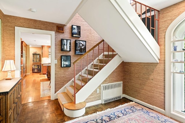 21 Fremont St, Dartmouth, MA 02748 - stairs featuring radiator heating unit, baseboards, and plenty of natural light