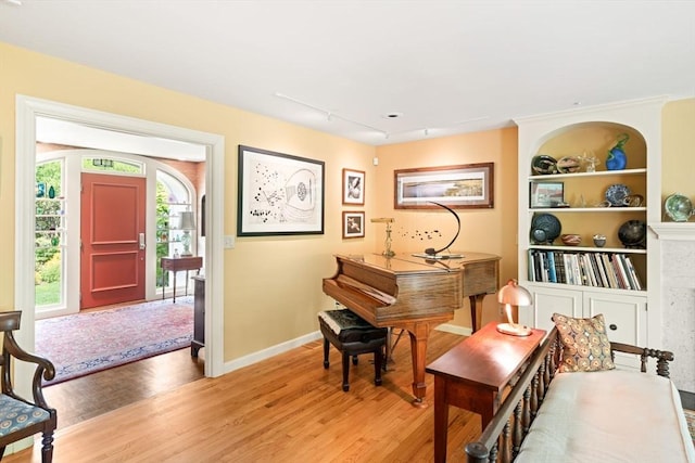 21 Fremont St, Dartmouth, MA 02748 - entrance foyer featuring light wood finished floors, baseboards, and rail lighting