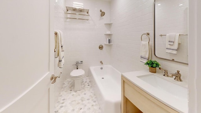 bathroom with toilet, vanity, and shower / tub combination