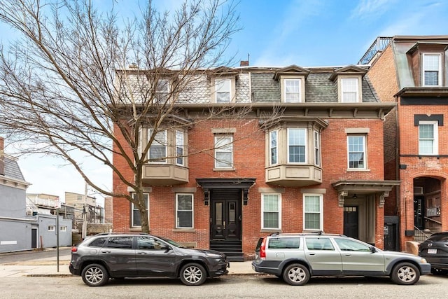 161 I St Unit 1, Boston, MA 02127 - victorian home with brick siding, mansard roof, and a chimney