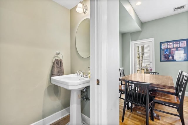 161 I St Unit 1, Boston, MA 02127 - bathroom with baseboards and wood finished floors