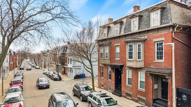 161 I St Unit 1, Boston, MA 02127 - view of asphalt road with sidewalks, entry steps, street lights, and a residential view