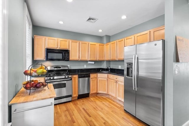 161 I St Unit 1, Boston, MA 02127 - kitchen with stainless steel appliances, light brown cabinets, light wood-type flooring, and recessed lighting