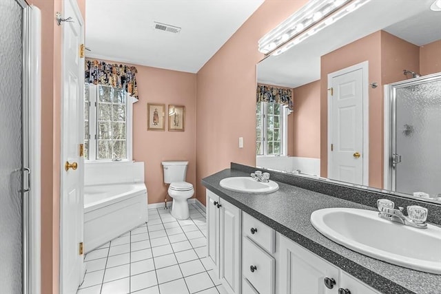 full bath featuring a sink, visible vents, a shower stall, and tile patterned floors