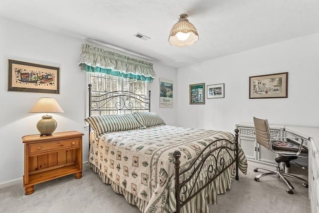 bedroom with carpet, visible vents, and baseboards