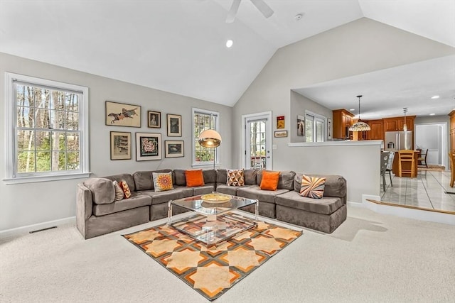 living room featuring baseboards, visible vents, recessed lighting, vaulted ceiling, and light carpet