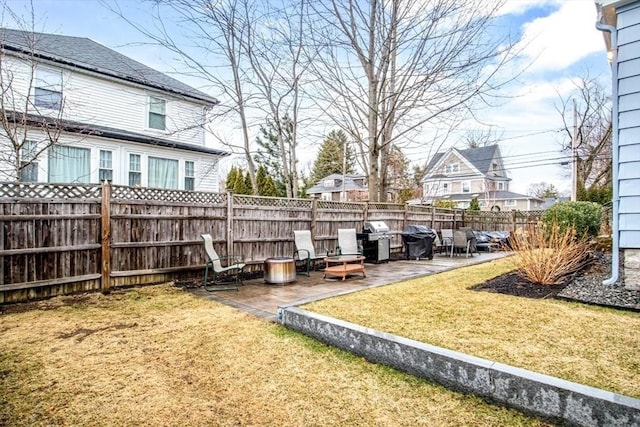 view of yard with a patio and fence