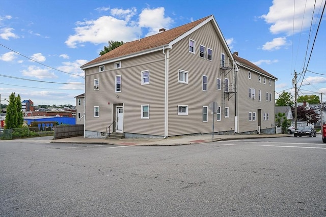 399 Bank St, Fall River, MA 02720 - view of side of home with entry steps and a chimney