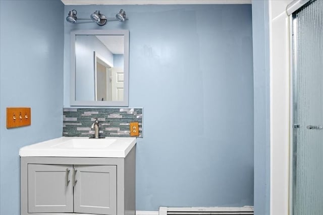 23 Vincent Cir, Worcester, MA 01604 - bathroom featuring decorative backsplash, vanity, and a baseboard heating unit