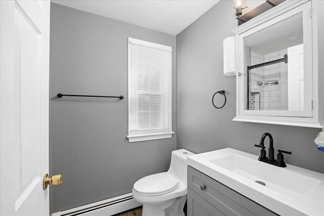 23 Vincent Cir, Worcester, MA 01604 - bathroom featuring a baseboard heating unit, vanity, toilet, and a tile shower