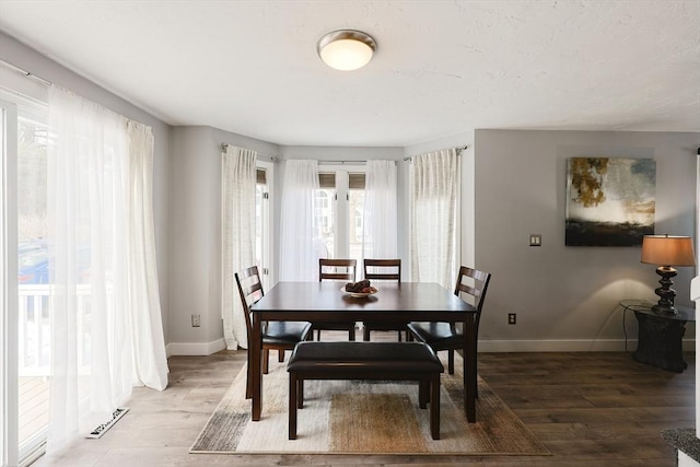 dining area with wood-type flooring