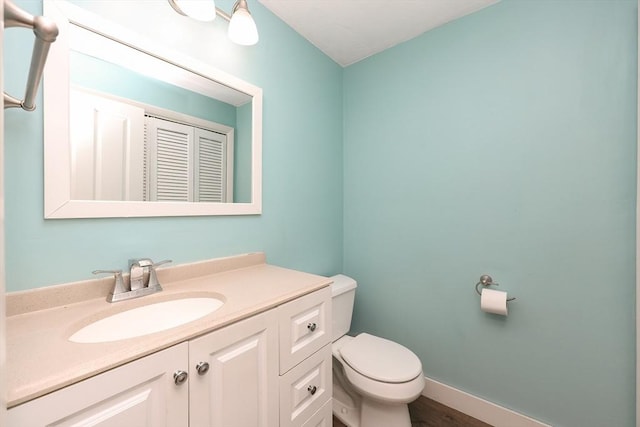 bathroom with vanity and toilet