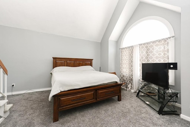 carpeted bedroom featuring lofted ceiling