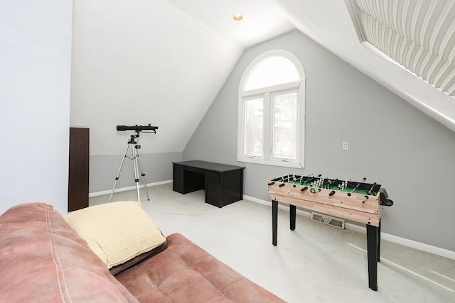 playroom with vaulted ceiling and carpet