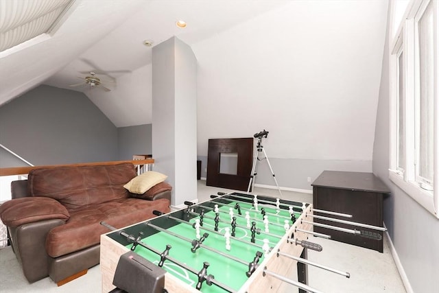 game room with ceiling fan, carpet flooring, and vaulted ceiling