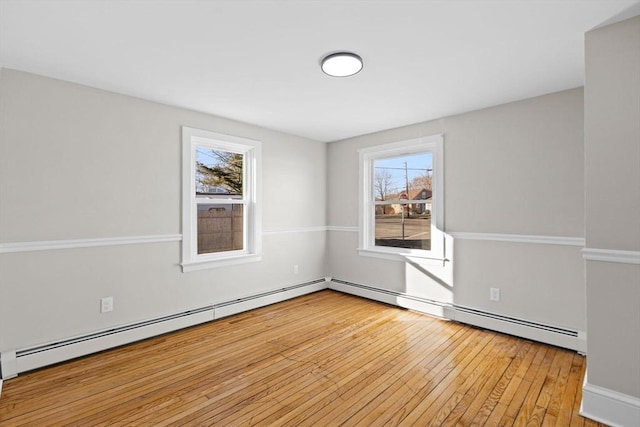 spare room with plenty of natural light and light wood-type flooring