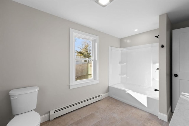 bathroom featuring tile patterned floors, toilet, bathing tub / shower combination, and a baseboard heating unit