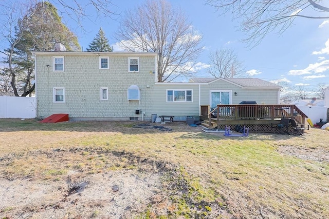 back of house with a yard and a wooden deck