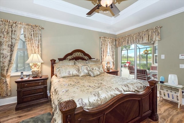 10852 Tiberio Dr, Fort Myers, FL 33913 - bedroom featuring ornamental molding, access to outside, and wood finished floors