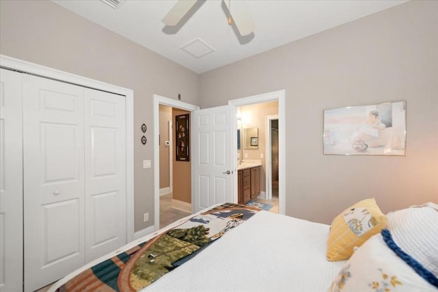10852 Tiberio Dr, Fort Myers, FL 33913 - bedroom featuring a closet, baseboards, a ceiling fan, and connected bathroom