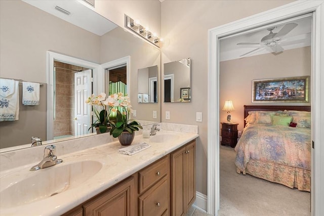 10852 Tiberio Dr, Fort Myers, FL 33913 - full bathroom featuring ceiling fan, a sink, visible vents, and connected bathroom