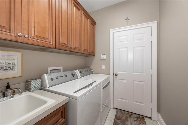 10852 Tiberio Dr, Fort Myers, FL 33913 - laundry area with a sink, washing machine and clothes dryer, and cabinet space