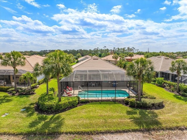 10852 Tiberio Dr, Fort Myers, FL 33913 - view of swimming pool with a fenced in pool, a yard, a patio area, and a lanai
