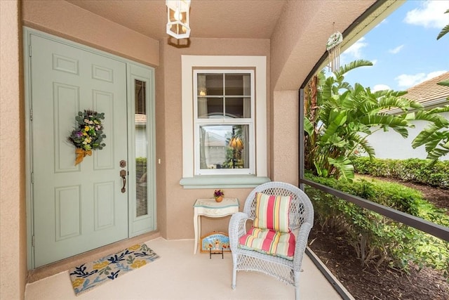10852 Tiberio Dr, Fort Myers, FL 33913 - view of exterior entry featuring stucco siding