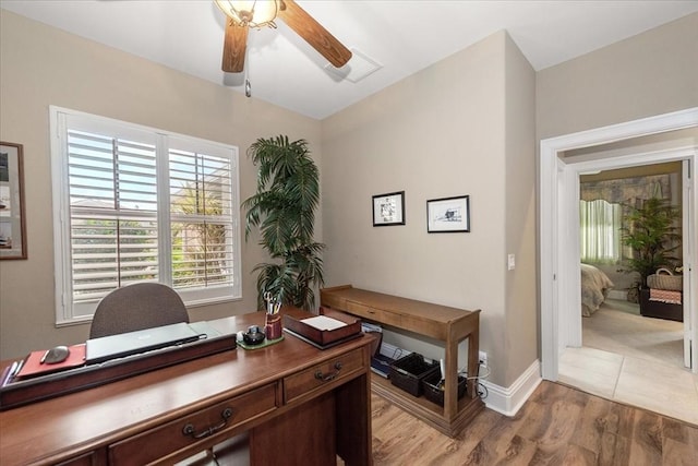 10852 Tiberio Dr, Fort Myers, FL 33913 - office area featuring light wood-style flooring, ceiling fan, baseboards, and visible vents