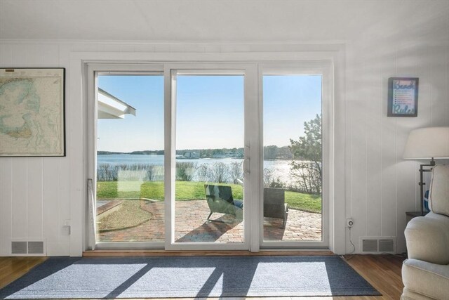 30 Captain Nickerson Ln, Dennis, MA 02660 - doorway featuring wood finished floors, visible vents, and a water view