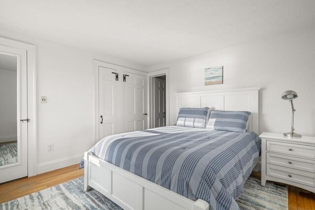 30 Captain Nickerson Ln, Dennis, MA 02660 - bedroom featuring wood finished floors, a closet, and baseboards