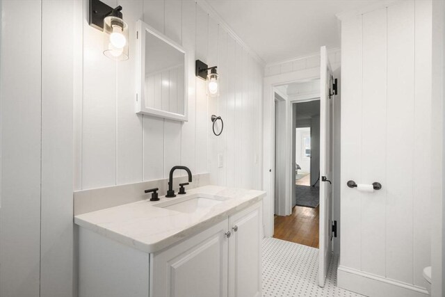 30 Captain Nickerson Ln, Dennis, MA 02660 - bathroom featuring crown molding, vanity, toilet, and tile patterned floors