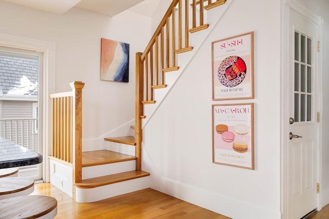 stairs with wood finished floors