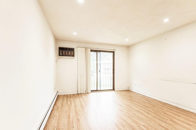 395 Merrimack St Unit 35, Methuen, MA 01844 - spare room with light wood-type flooring, recessed lighting, and a baseboard heating unit