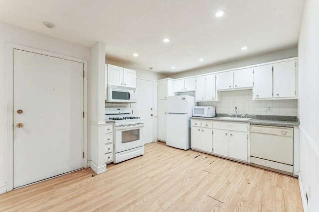 395 Merrimack St Unit 35, Methuen, MA 01844 - kitchen with white appliances, light wood finished floors, decorative backsplash, white cabinetry, and recessed lighting